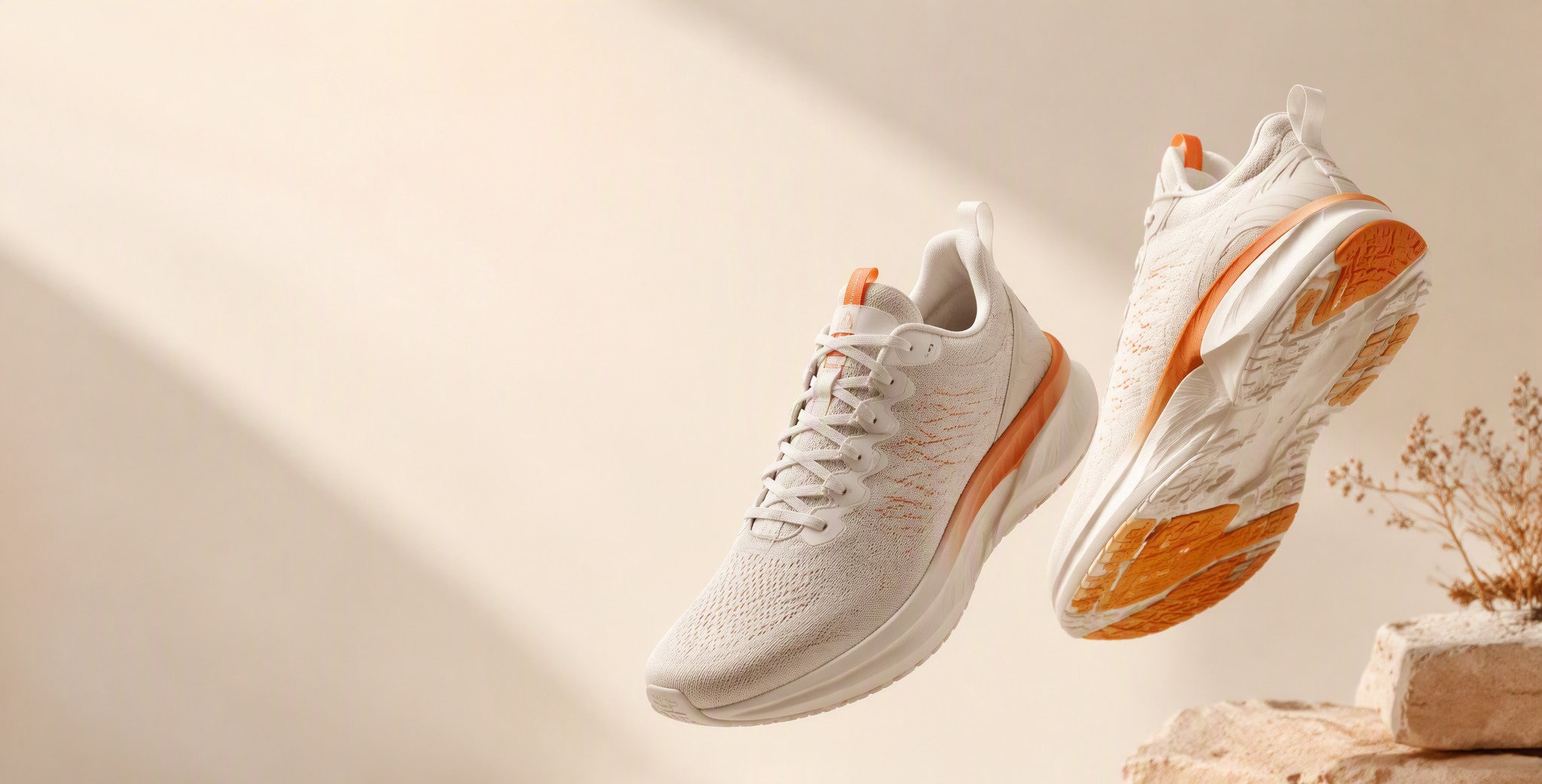 Premium running shoes on ivory studio background